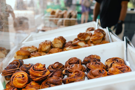 Sweet cinnamon rolls on a table in a local Portuguese bakery. The healthy eating and traditional...
