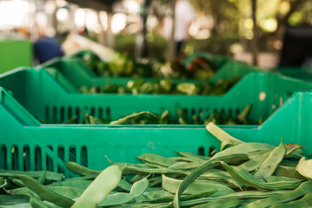 Fresh vegetables at small local urban market. Organic produce on sale at outdoor farmer market....