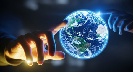 two hands reaching out to touch a glowing earth globe in a dark setting, representing connection and future.の写真素材