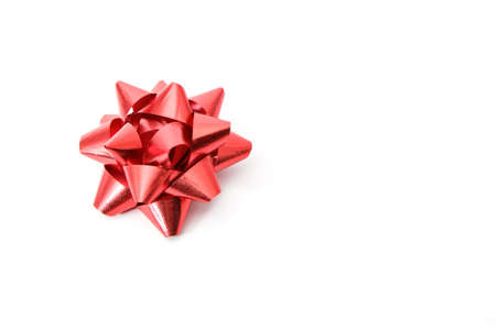 Red bow isolated on white backgroundの写真素材
