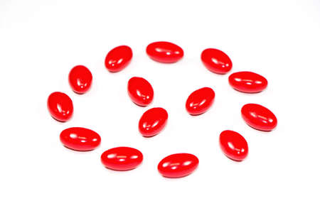 vitamin supplement capsules on white backgroundの写真素材