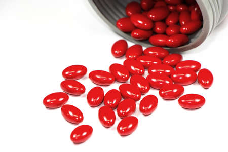 vitamin supplement capsules on white backgroundの写真素材