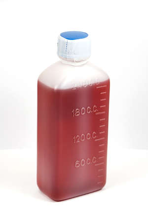 Brown mixture in white plastic bottleの写真素材