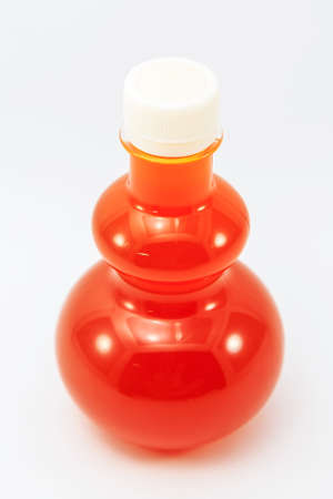 orange juice in bottle isolate on backgroundの写真素材