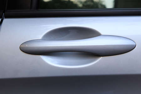 Handle of a silver car doorの写真素材