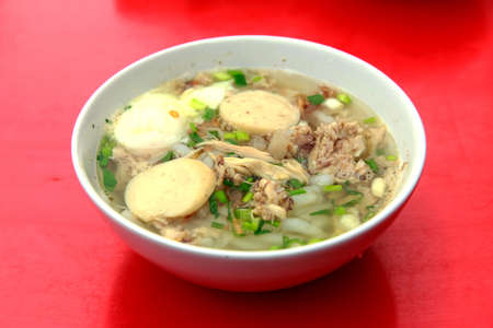 Chicken Porridge served on red tableの写真素材