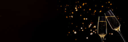 Banner Glasses of champagne on black background with lightsの写真素材