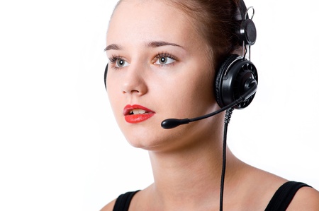 Beautiful call center operator with headset. Isolated over white backgroundの写真素材