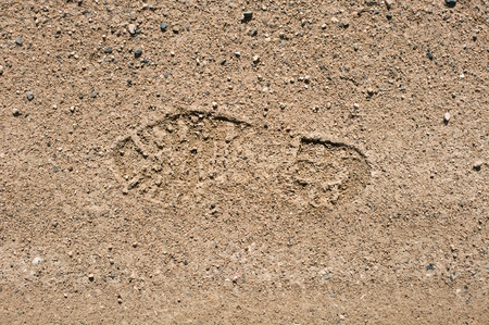Imprint of the shoe on on dry landの写真素材