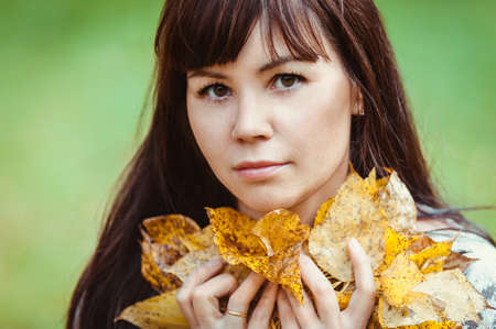 Photo of beautiful pretty brunette woman, fall season conceptの写真素材