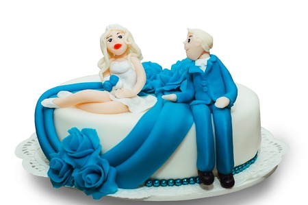 Wedding cake decorated with figures of the newlywedsの写真素材