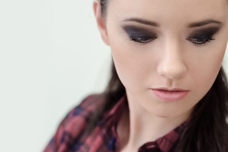 Beautiful Face of Young Woman with Clean Fresh Skin. Professional Make-up.  Close-up. Copy spaceの写真素材