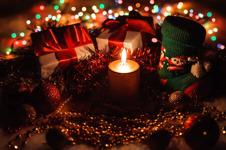 Holiday composition with candle and decorations. New Year Celebration. Christmastimeの写真素材