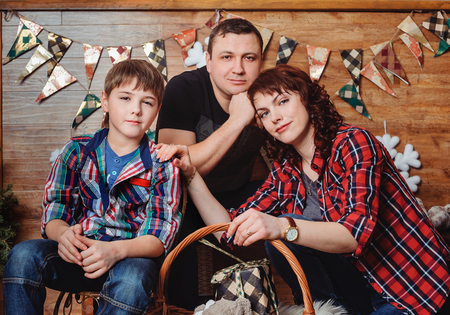Portrait of loving caring family with son indoorsの写真素材
