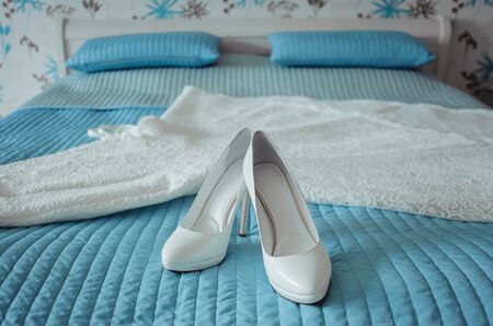 stylish white bridal shoes, details of the wedding, the bride's roomの写真素材