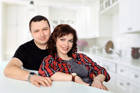 Portrait of smiling married couple at homeの写真素材