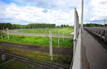 Road bridge over the highway and railway. Modern bridge fragmentの写真素材