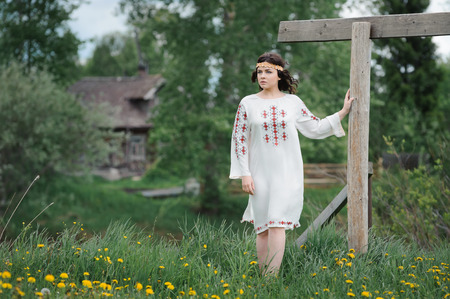 Portrait of a beautiful girl in Slavic clothes. Summertimeの写真素材