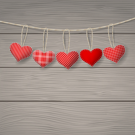 Red hearts hanging over wood background. Happy Valentines day. Space for your text.のイラスト素材