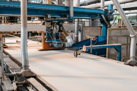 Workshop for the production of particle boards. Manufacture of chipboard, veneer, plywood, wood panels. Wood processing. Woodworking industryの写真素材