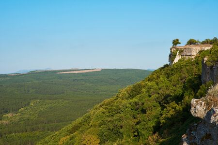 Beautiful views of the mountains and hills covered with vegetation. Green valley between the mountains. Sunny summer day, clear blue sky. Natural backgroundの写真素材