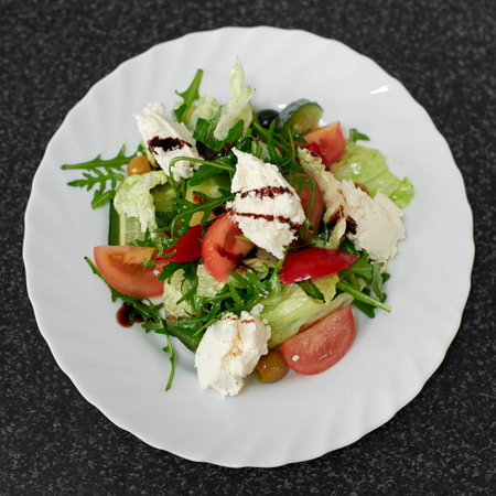 Salad with cheese and fresh vegetables. Greek salad. Top viewの写真素材