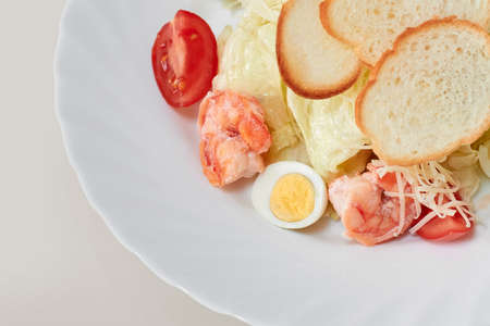 Gourmet caesar salad with shrimps and croutons.の写真素材