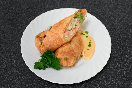 Puff pastry roll stuffed with salmon and broccoliの写真素材