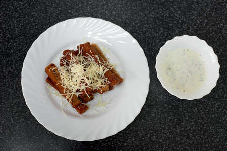 Rye bread croutons with cheese, garlic and sauce. Top viewの写真素材