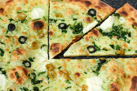 Delicious vegetarian pizza with olives and herbsの写真素材