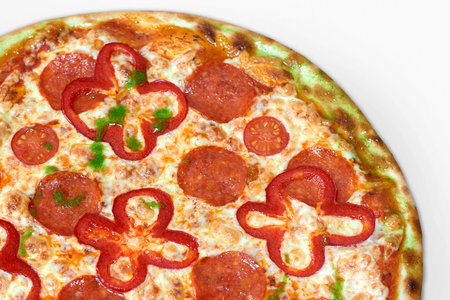 Tasty pizza with salami, red pepper and tomatoesの写真素材