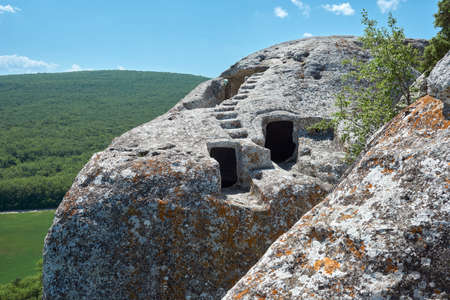 Ancient cave city. Medieval fortress-city. The entrance to the cave. Cave mountain town in Crimea.の写真素材