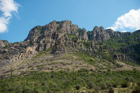 Beautiful sunny landscape of Demerdzhi rocky mountain and green forestの写真素材