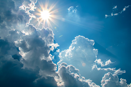 sun and a cloud in a blue sky.の素材
