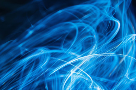 The image is a blue and white abstract painting with a lot of blue lines. The blue lines are wavy and seem to be moving, creating a sense of motion and energyの素材