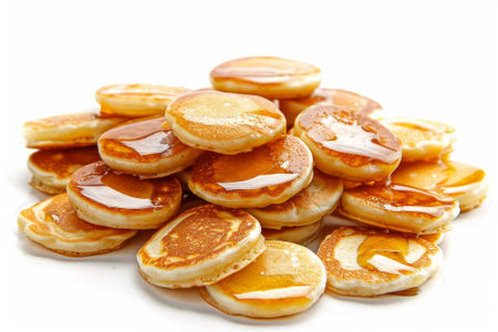 A stack of pancakes with syrup on top. The pancakes are golden brown and appear to be freshly made. Concept of warmth and comfort, as pancakes are often associated with breakfast and family gatheringsの素材