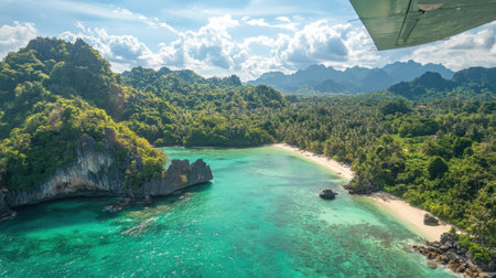 A beautiful beach with a mountain in the background. The sky is clear and the water is calmの素材