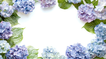A delicate border of hydrangea flowers in shades of blue and purple surrounds a blank space. Fresh green leaves add a touch of nature, perfect for spring themes.の素材