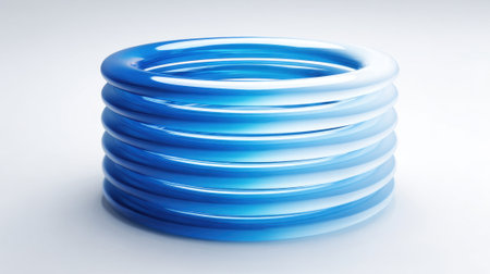 Bright blue circular rings are stacked neatly showcasing a smooth and reflective surface that draws attention.の素材