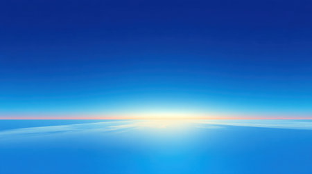 Soft light breaks the quiet morning as dawn paints the horizon with vibrant colors over tranquil waters.の素材