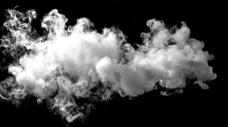 Swirling white smoke dances in the air forming unique shapes against a dark backdrop.の素材