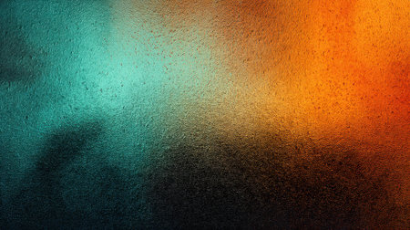 A blend of blue orange and black colors is displayed on a smooth surface. The shades mix together forming a textured visual. This scene showcases artistic creativity in abstract form.の素材