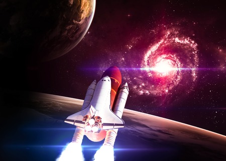 Space shuttle taking off on a mission.の写真素材