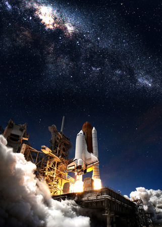 Space shuttle taking off on a mission.の写真素材
