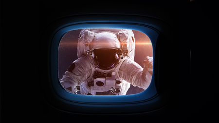 Beautiful cosmos in space ship window porthole. Elements of this image furnished by NASA.の写真素材
