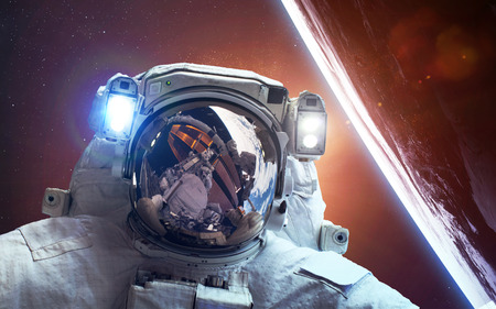 Astronaut in space over the planet Earth.