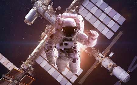 International Space Station with astronaut over the planet Earthの写真素材