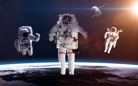 Astronaut in outer space against the backdrop of the planet earth.