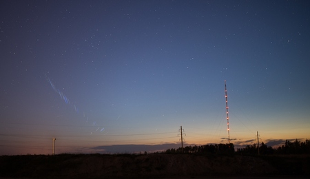 Starry sky and summer meadowの写真素材