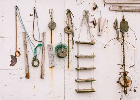 Old fishing tackle of Icelandic seamen on the white wall